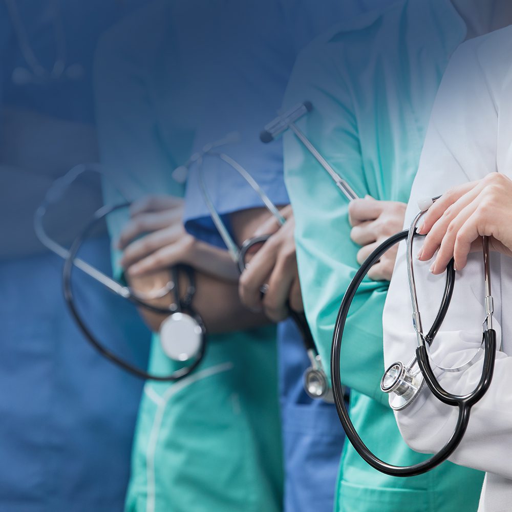 partial view of group of medical workers with equipment in laboratory