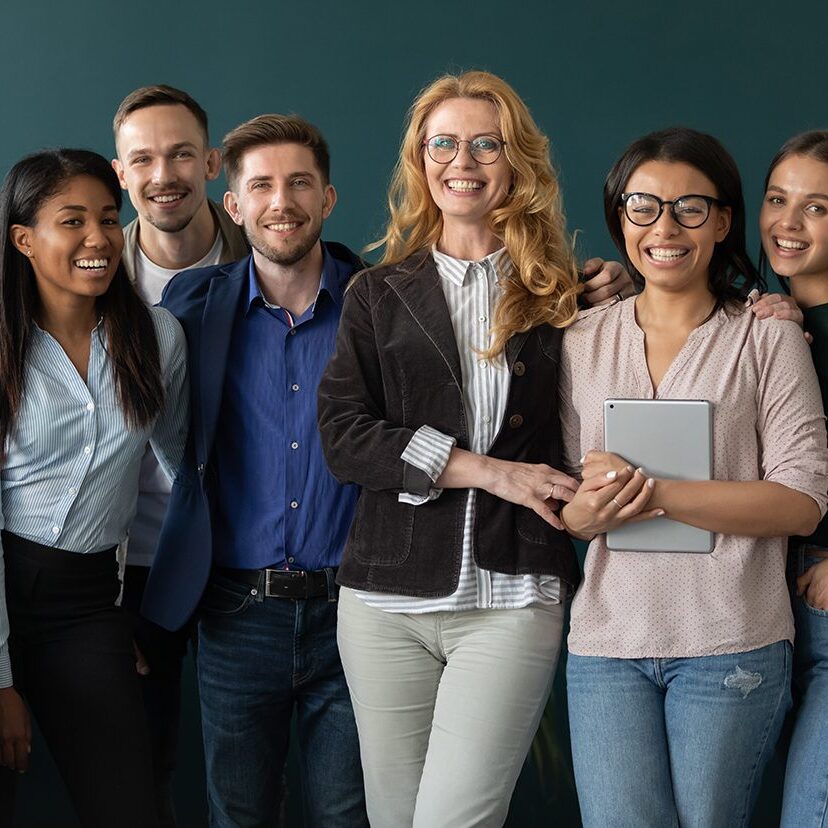 Portrait of standing in row smiling team embracing looking at camera. Happy diverse corporate staff, hugging specialists, company representatives, bank workers photo shoot, HR agency recruitments.