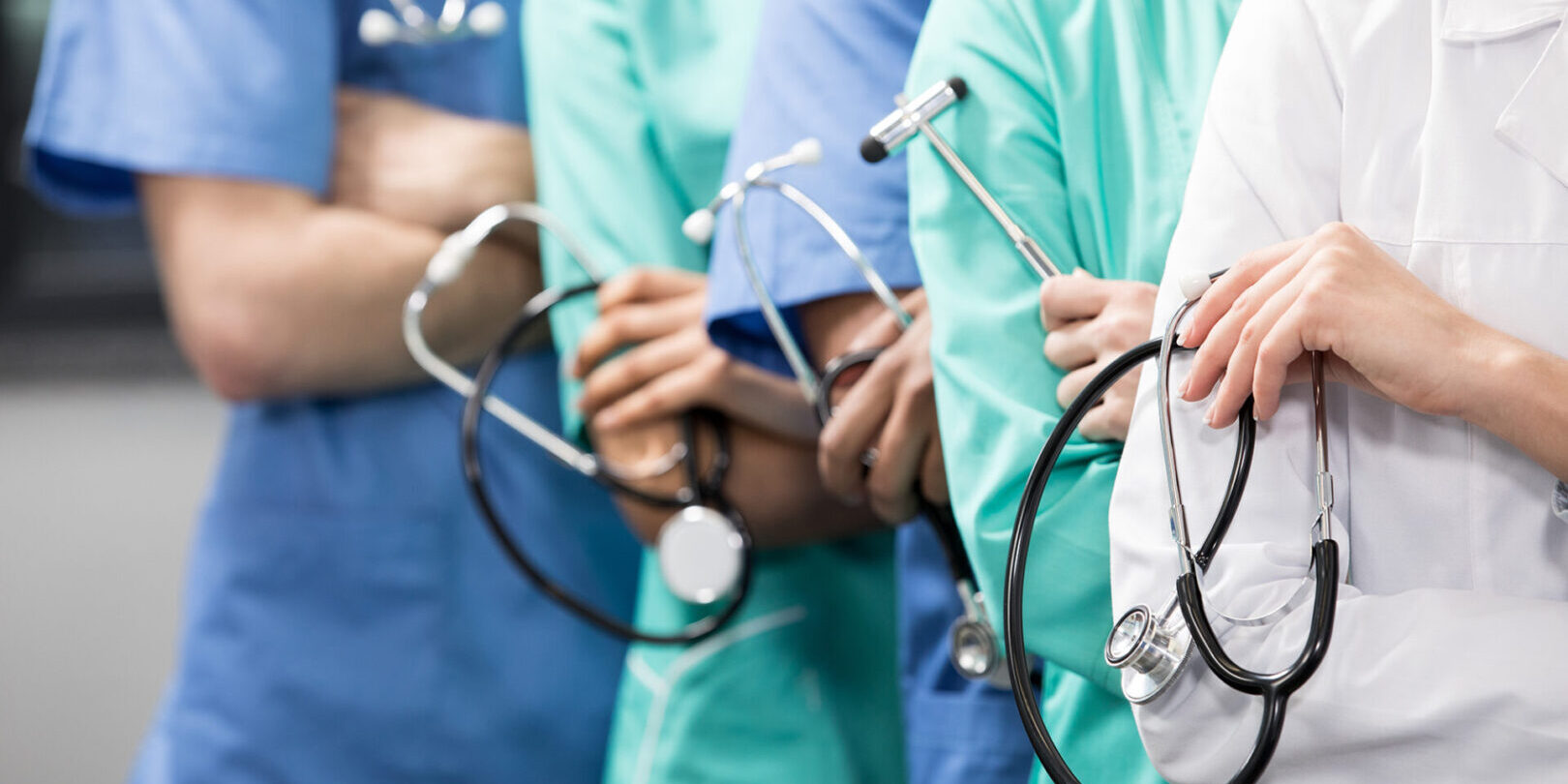 partial view of group of medical workers with equipment in laboratory